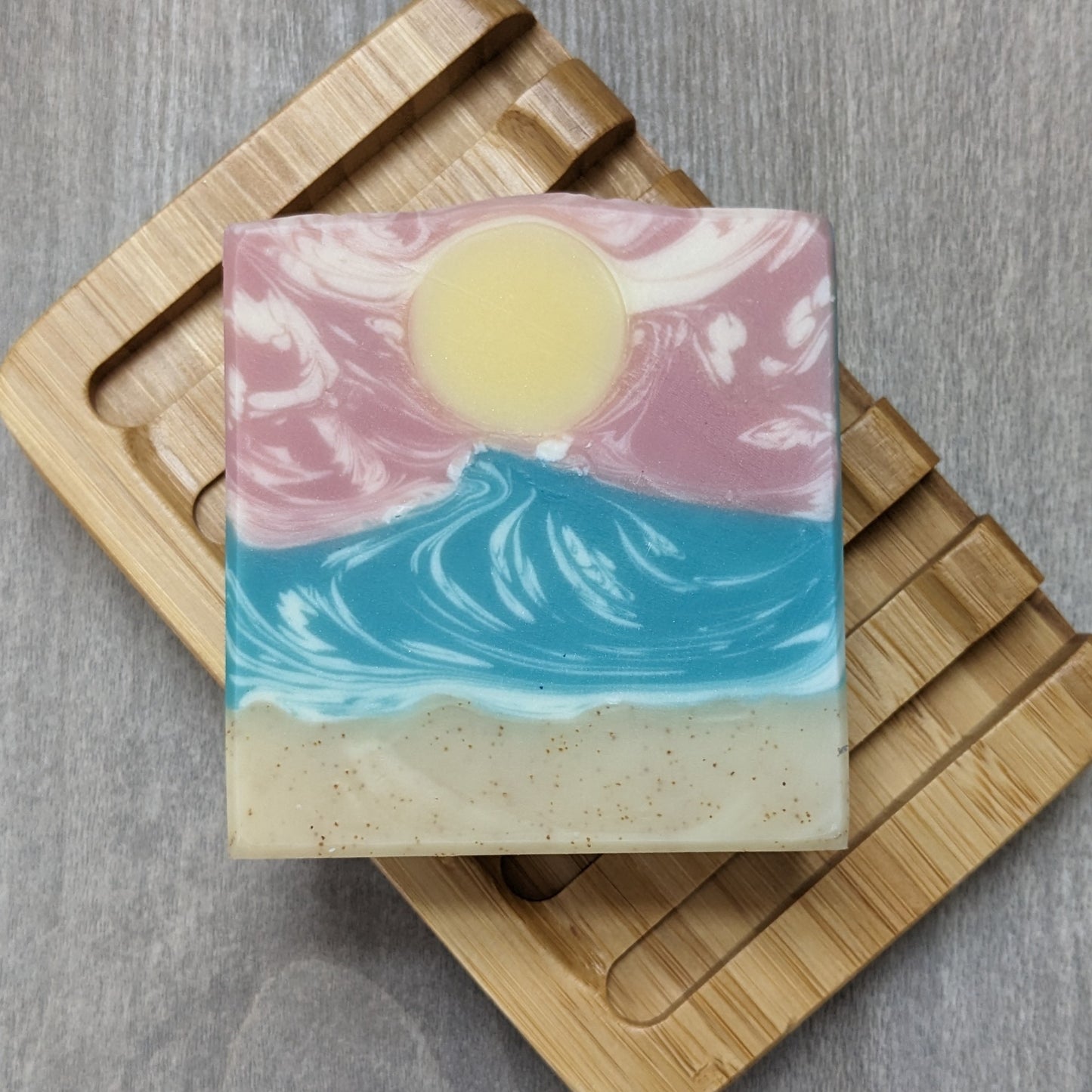 Soap with sand and wave design on soap dish
